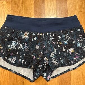 Ivviva by lululemon girls teal floral print speedy shorts size 14